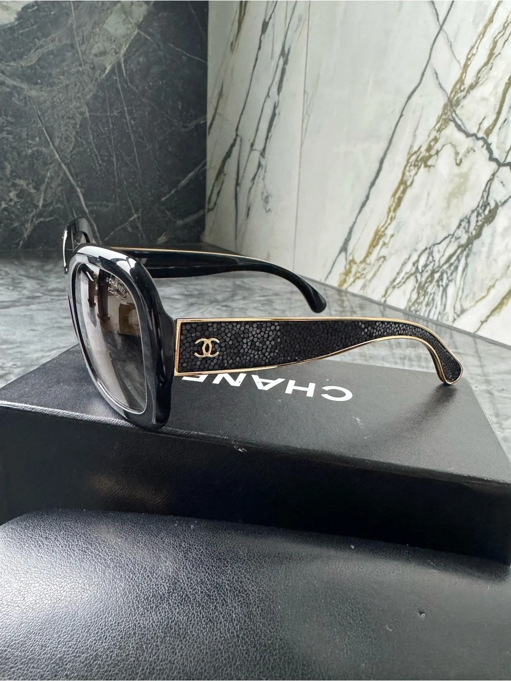 CHANEL Black Sunglasses with Gold Logo Accent